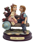 Montefiori Collection boy and girl on bench sculpture figurine