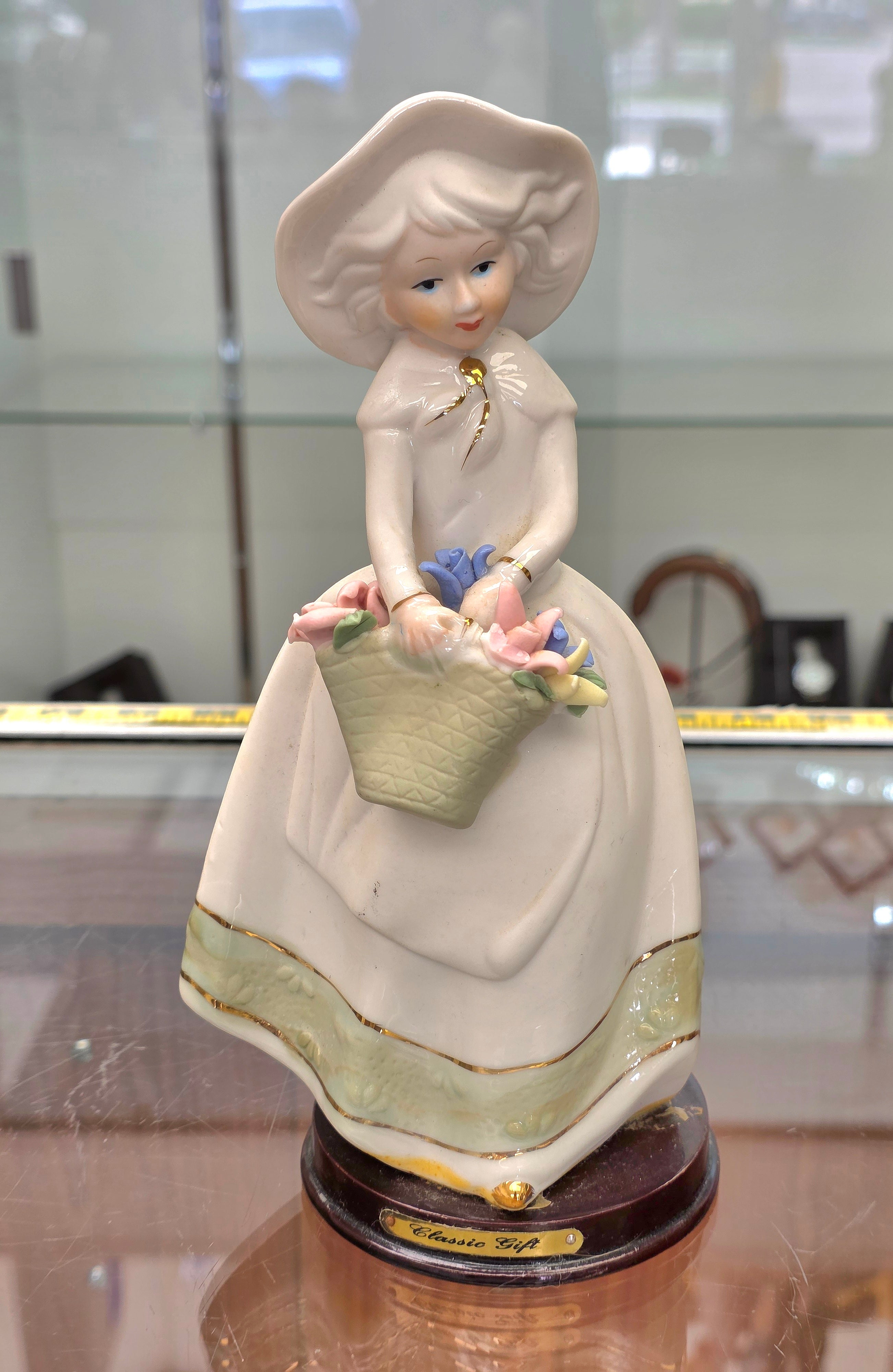 Girl with flower basquetv porcelain figurine 8.25" hr