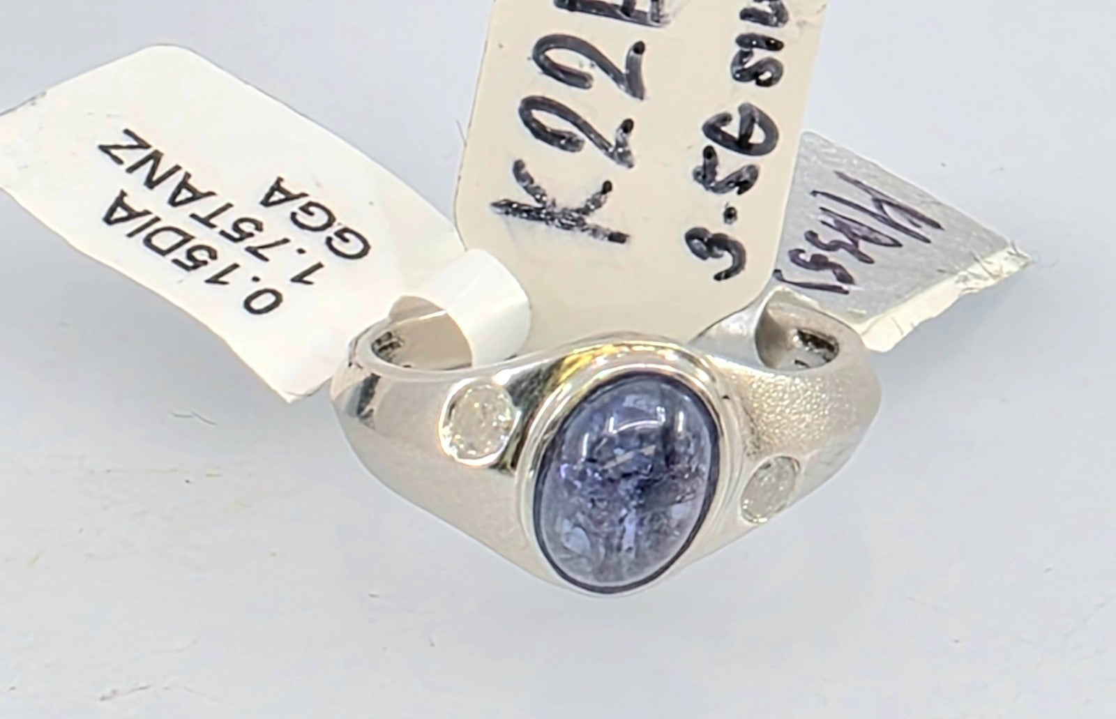 GGA Silver  1.75 ct Tanzanite and .15 Diamond Ring