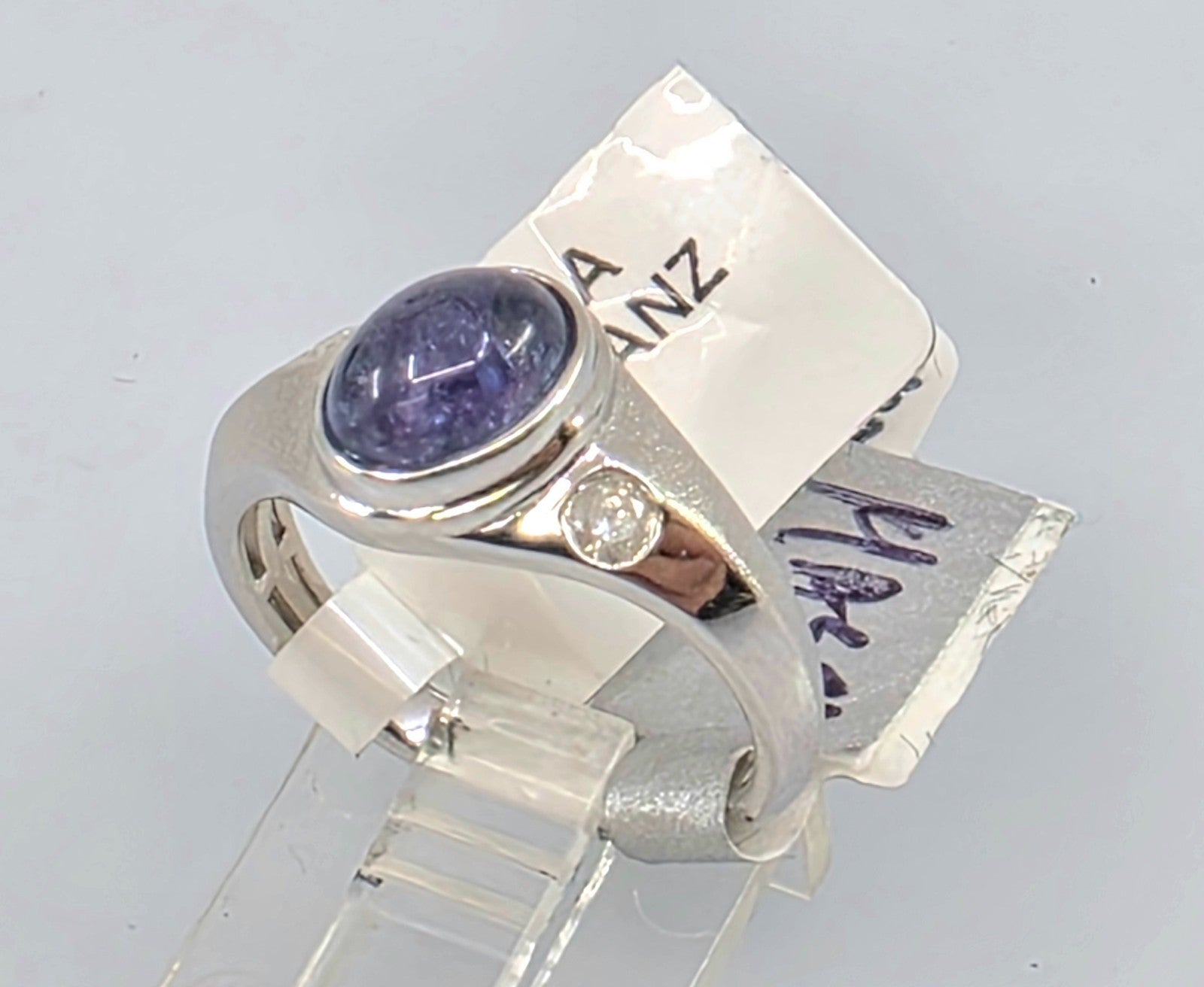 GGA Silver  1.75 ct Tanzanite and .15 Diamond Ring